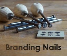 some nails are laying on top of each other with the words branding nails above them