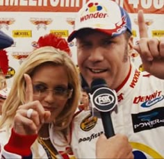 the nascar driver and his wife are making an obscene gesture for the cameraman in front of them