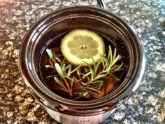 a cup filled with water and lemon slices