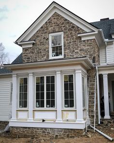 a house being built in the process of being remodeled with new windows and sidings