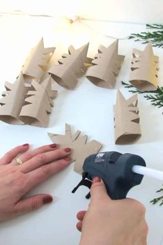 From Trash to Treasure: How to Transform Toilet Paper Rolls into Delicate Snowflake Ornaments Crafts With Paper Rolls, Toilet Paper Roll Star Ornament, Cupcake Liner Ornaments, Toilet Paper Roll Stars, Recycled Christmas Tree Ideas, Toilet Paper Christmas Tree