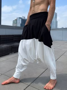 "Harem Pants for Men. Black and White Samurai Style Pants. -Soft fabric -Comfortable and relaxed fit -2 side pockets -Black elastic waistband and leg cuffs + drawstring to secure the waistline. Style it with sandals or boots, make it formal or informal... This urban style pant is great for a casual city look, as well as an edgy festival wear. Materials: - white cotton jersey and black cotton jersey. (90% cotton 10% lycra) Fabric for this pair was bought in Fashion District, LA and the pant was h Sarouel Pants, Ninja Pants, Samurai Pants, Yoga Pants Men, Harem Pants Men, Burning Man Costume, Black And White Pants, Harem Pants Women, Fashion District