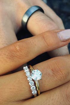 two people with wedding rings on their fingers