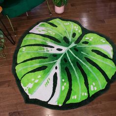 a green and white rug on the floor