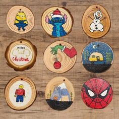 twelve handmade christmas ornament designs on wood