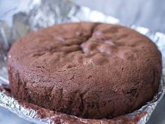 a chocolate cake sitting on top of aluminum foil