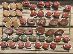 there are many different kinds of doughnuts on the table and one is chocolate