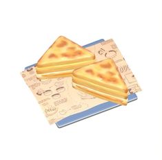 two pieces of toast sitting on top of a blue and white paper with money in the background