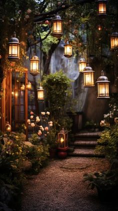 a pathway with lanterns hanging from it's sides