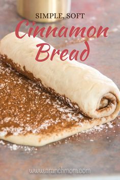 cinnamon bread rolled up on top of a table