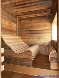 a wooden sauna with two benches in it