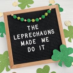 a sign that says the leprechauns made me do it surrounded by shamrock leaves