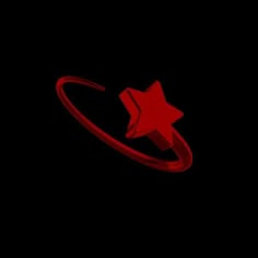 a red ring with a star on it is lit up in the dark night sky