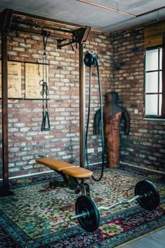 a bench in the middle of a room with a brick wall behind it and a shower