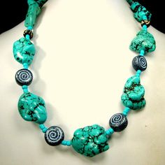 "Chunky Turquoise Stone Bead Necklace, Tribal Magnesite or Howlite w Black White Ceramic Spiral Beads, OOAk R Starr i just opened a box from my storage, all goodies set aside since My NYC shop closed decades ago. i was an importer from the mid-east and found these fabulous ceramic spiral beads in black & white beads from the 1970s and they SCREAMED at me... make me into a fabulous necklace So I did!! This dramatic big bead necklace is 20\" long ( 50.8cm ) The huge turquoise stone nuggets, ma Turquoise Necklace With Spacer Beads For Beach, Unique Beaded Turquoise Necklace For Beach, Handmade Turquoise Spiral Jewelry, Handmade Spiral Turquoise Jewelry, Unique Spiral Turquoise Jewelry, Turquoise Beads With Natural Stones For Festival, Unique Turquoise Beaded Necklaces With Large Beads, Unique Turquoise Beaded Necklaces For Beach, Unique Turquoise Beaded Necklace With Large Beads