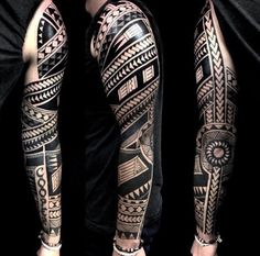 two men's arms with tattoos on them, one is black and the other is grey