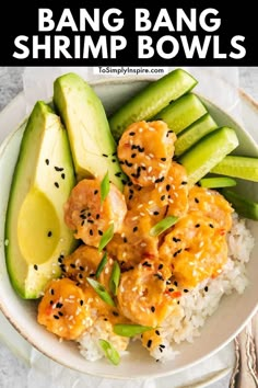 a white plate topped with shrimp and rice next to cucumber, avocado