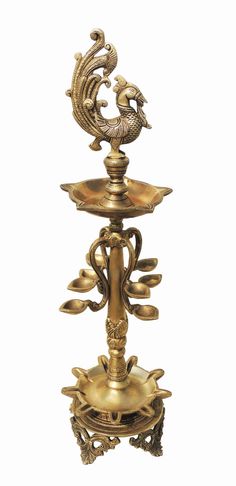 an ornately decorated brass candle holder