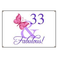 a sign that says 33 and fabulous with a butterfly on it