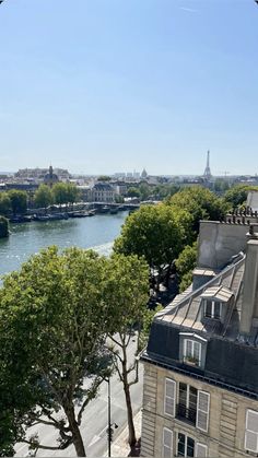 a view of the seine river from an apartment building in paris, france on a sunny day