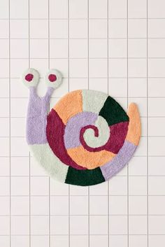 a colorful rug with a snail on it