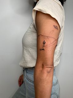 a woman with a tattoo on her arm