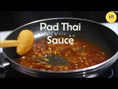 a pan filled with food and the words pad thai sauce