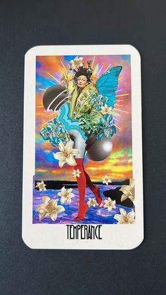 a tarot card with an image of a fairy on it