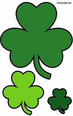 four leaf clovers with one green shamrock on the left and another three - leaf clover on