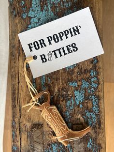 a sign that says for poppin'btiles on top of a piece of wood