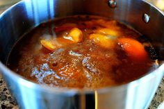 a pot filled with soup sitting on top of a counter