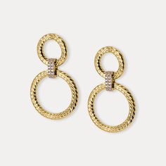 These elegant Italian-made earrings feature a captivating double-circle design, crafted from 925 sterling silver and plated with 18K gold for a luxurious shine. The larger and smaller textured circles are beautifully intertwined, creating a striking silhouette that is both modern and timeless. A central zirconia-studded ring adds a dazzling touch of sparkle, enhancing the luxurious feel of the piece.   Details * Sterling silver 925, 18K Gold Plated, Handmade, Zirconia Stones  * Length: 1.70 in . Diameter:                  Larger Loop  1 in                  Smaller Loop 0.65 in Circle Design, Jewelry Earrings Hoops, Silver 925, Favorite Jewelry, Etsy Earrings, 18k Gold, Jewelry Earrings, Hoop Earrings, Sparkle