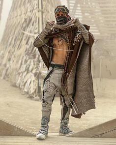 This look is a masterclass in desert warrior aesthetics, from the meticulously layered neutrals to the striking mask and leather details, perfectly capturing the spirit of adventure and resilience 🤩🌪️ @jessewelle 🔥🔥 Rave Aesthetic Outfit, Male Rave Outfits, Wasteland Outfit, Desert Clothing, Apocalypse Clothing, Desert Warrior, Desert Outfit, Rave Aesthetic, Festival Outfit Inspiration