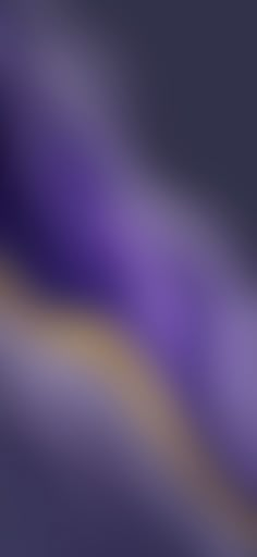 an abstract blurry image of purple and yellow colors in the dark blue, black, white and grey hues