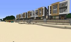 a row of buildings sitting on top of a sandy beach