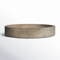 an empty wooden bowl on a white background