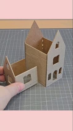 someone is making a house out of cardboard