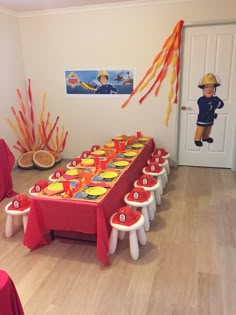 a fireman themed birthday party with orange and red decorations