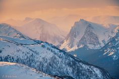 the mountains are covered in snow and there is no image on this page to describe