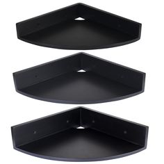 two black corner shelves with holes in the middle and one on each side, set against a white background