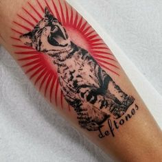 a tattoo with an image of a wolf on it