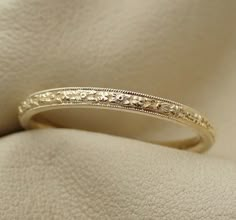 a wedding ring with filigrees on it