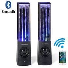 two computer speakers sitting side by side on top of each other, one with blue lights