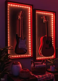 two guitars are lit up with red lights