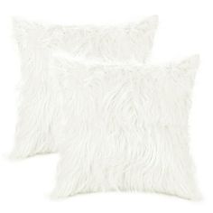 two white fluffy pillows on a white background