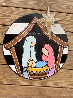 a christmas ornament with a nativity scene on it