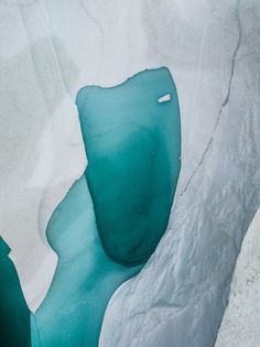 an ice cave with blue water in it