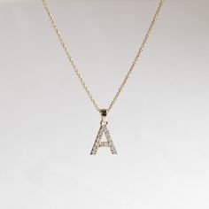 Diamond initials pendant necklace comes with adjustable 16"-18" gold chain. Metal: 14k Yellow Gold Stone: Natural Diamonds Stone Size: 1.4mm Diamond Color and Clarity: G+, VS Pendant Size: approx 10mm x 9mm varies by letter. Diamond Weight: 0.23 total carat weight for letter A Chain: 1.1mm, Adjustable 16" to 18" rolo chain Letter A - Z A Letter Pendant Gold, A Letter Necklace, Letter Pendent, Initials Pendant, G Necklace, Chain Letter, Diamond Initial Necklace, Initial Necklace Gold, Initial Pendant Necklace