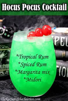 a green cocktail with two cherries on top and the words tropical rum spiced rum margarita mix midori