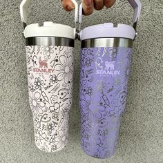 two tumblers are shown with the same pattern on them, one has a straw in it